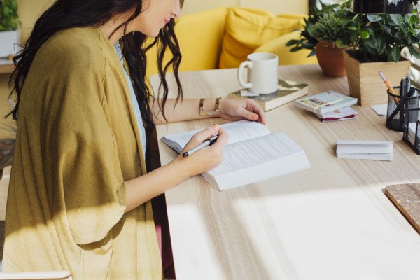 Caucasian woman studying at desk