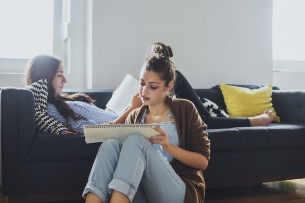 Caucasian women studying in living room