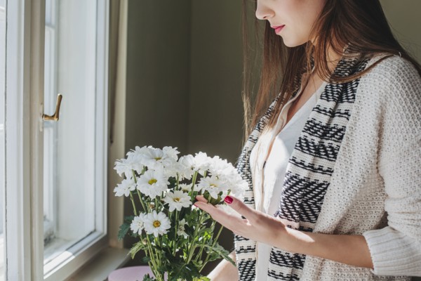 Woman arranging flowers