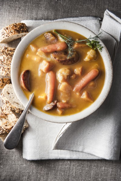 Bowl of stew with bread and napkin