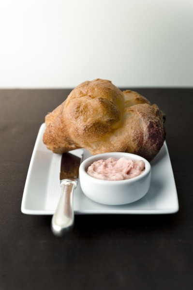 Popover with strawberry butter on plate