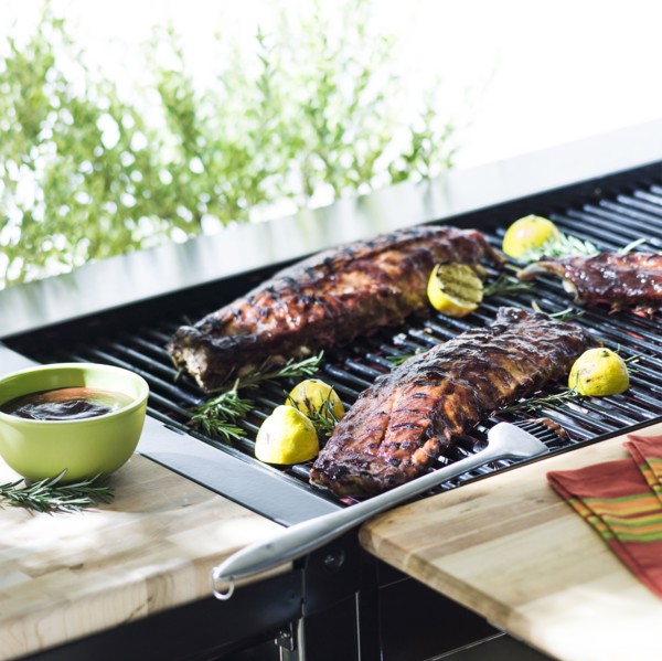 Beef ribs cooking on barbecue grille