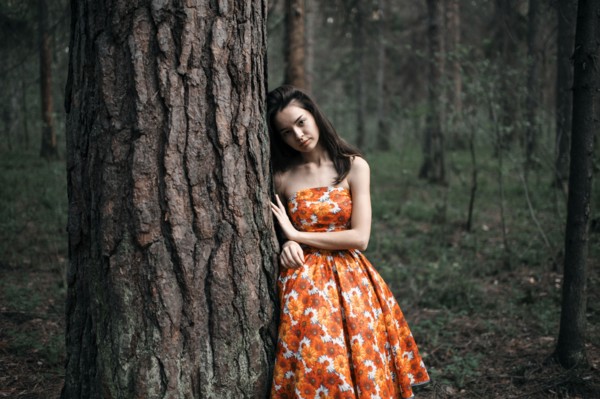 Caucasian woman standing in forest