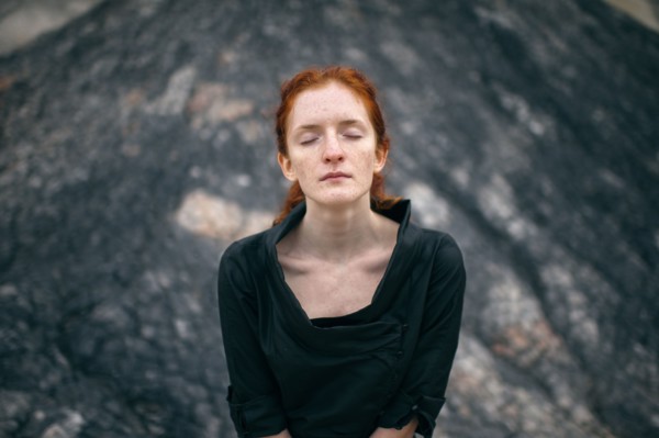 Caucasian woman standing on rock formation