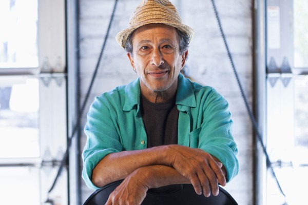 Older Caucasian man sitting in chair