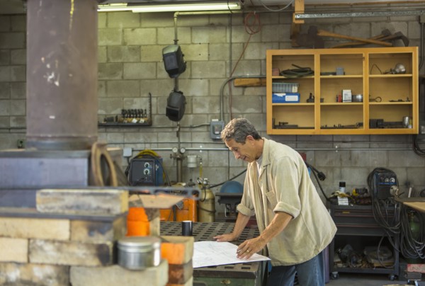Middle Eastern man working in workshop