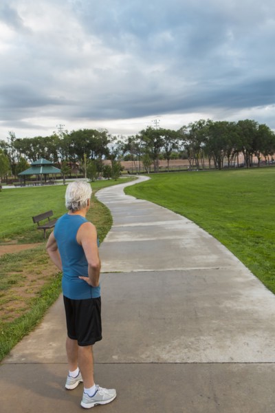 Hispanic man standing in park