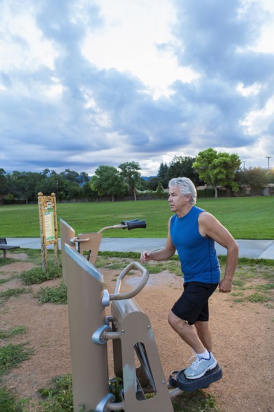 Hispanic man exercising in park