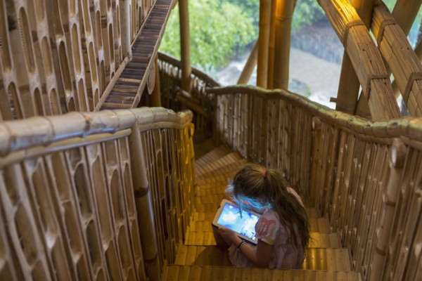 Caucasian girl using digital tablet on steps