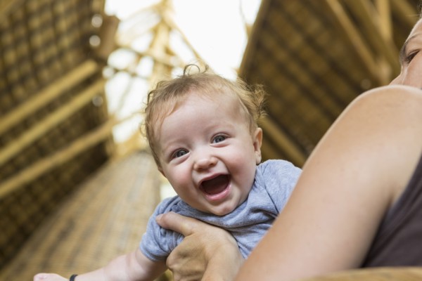 Caucasian mother playing with baby boy