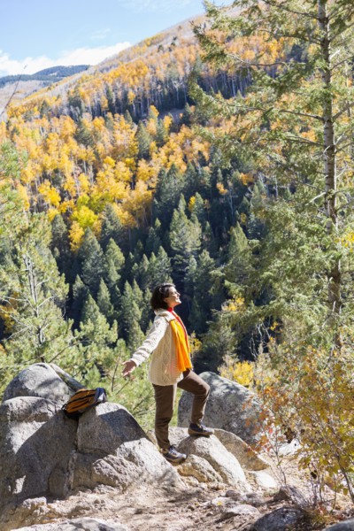 Mixed race woman admiring scenic view in forest