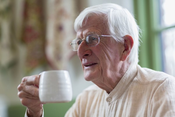 Older Caucasian man drinking coffee