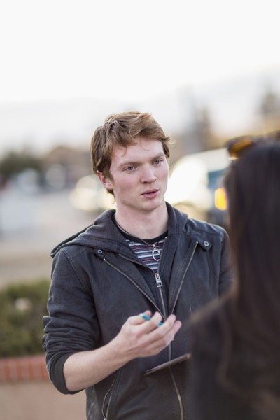 Canvasser talking to woman in city