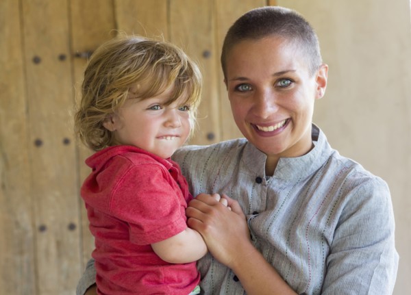 Caucasian mother and baby son smiling