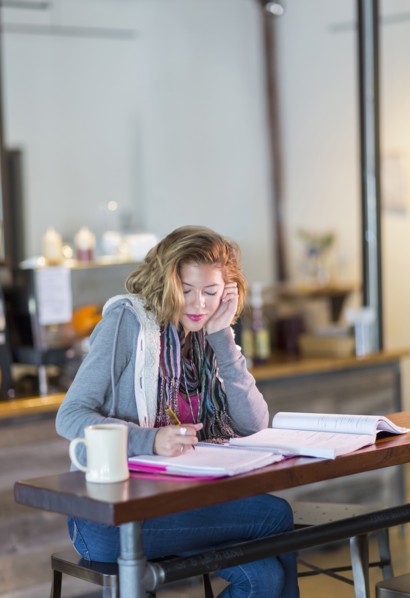 Mixed race student studying at table