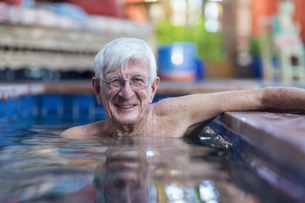 Portrait of smiling Caucasian man in swimming pool
