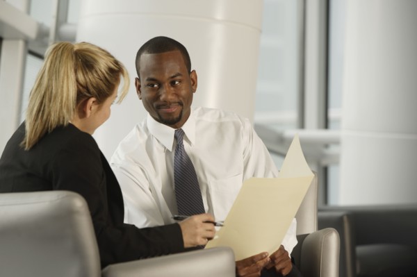 Multi-ethnic businesspeople discussing paperwork