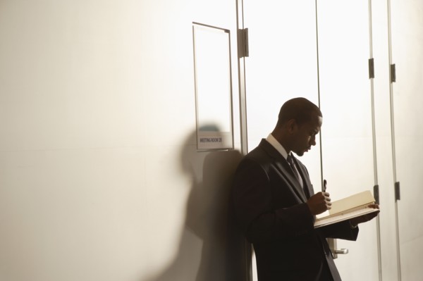 African American businessman looking at paperwork