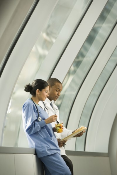 Doctor and nurse reviewing medical chart