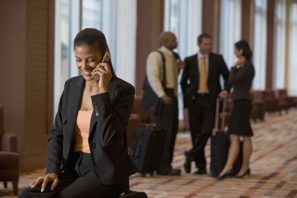 African businesswoman talking on cell phone