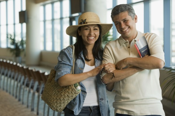 Hispanic couple waiting in airport