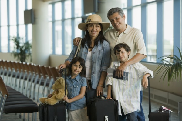 Hispanic family waiting in airport