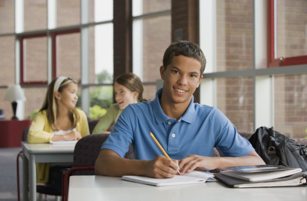 Mixed race teenager doing homework