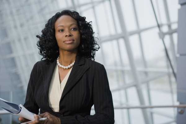 African businesswoman holding paperwork