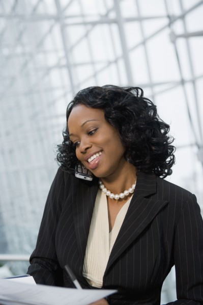 African businesswoman using cell phone