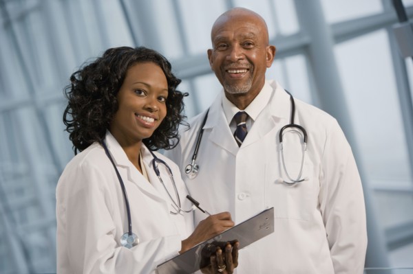 African doctors smiling with medical chart