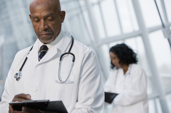 African doctor reviewing medical chart