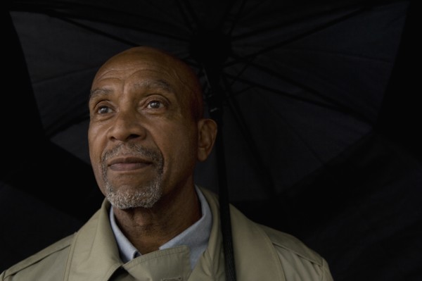 African businessman holding umbrella