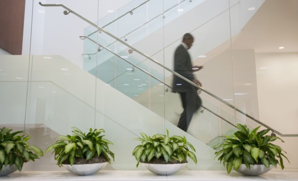 African American businessman descending staircase