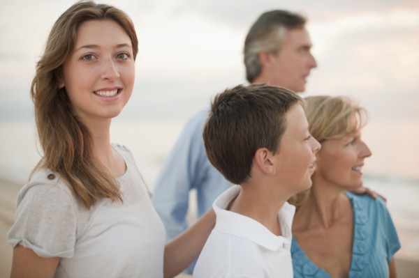 Caucasian family enjoying beach