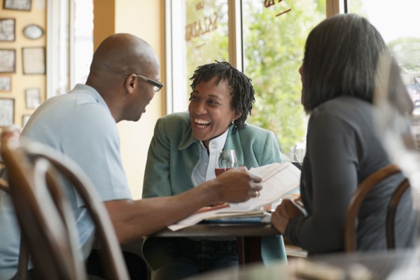 African American co-workers working in restaurant