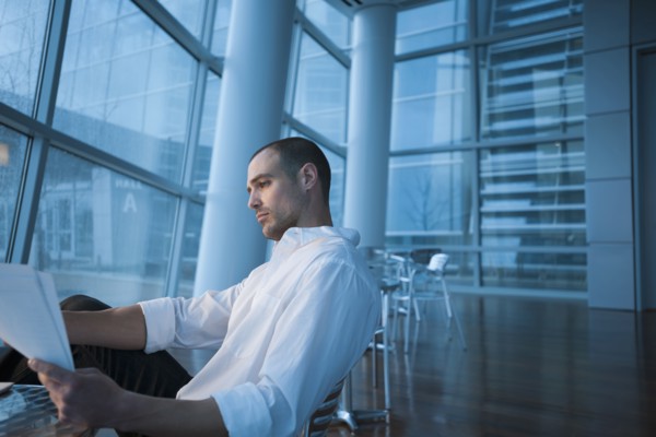 Caucasian businessman looking at paperwork