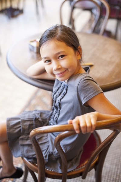 Asian girl sitting in cafe