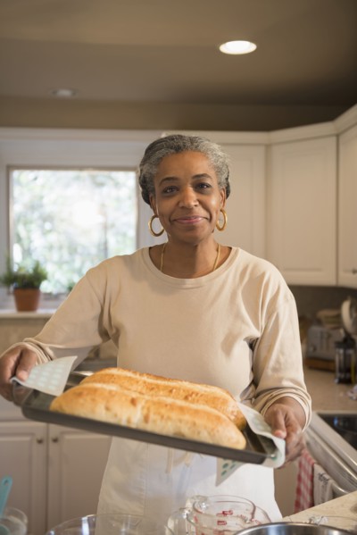 African American woman baking in kitchen