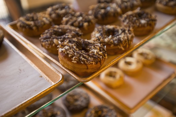 Close up of donuts for sale in bakery