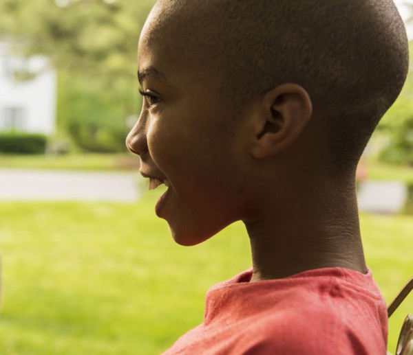 Profile of smiling African American boy