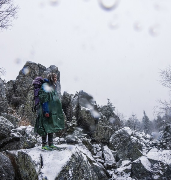 Caucasian hiker standing on rocky hillside