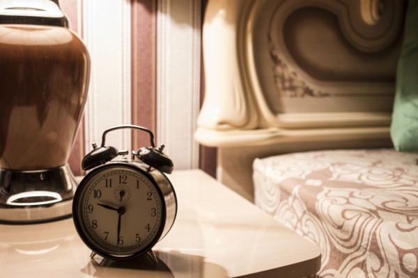 Alarm clock on bedside table