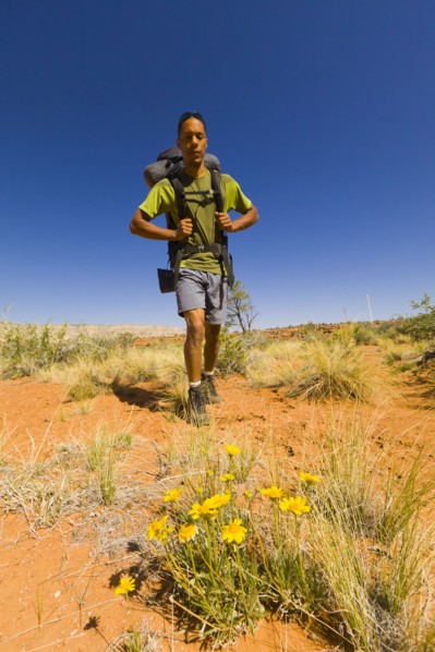 Black man hiking in desert
