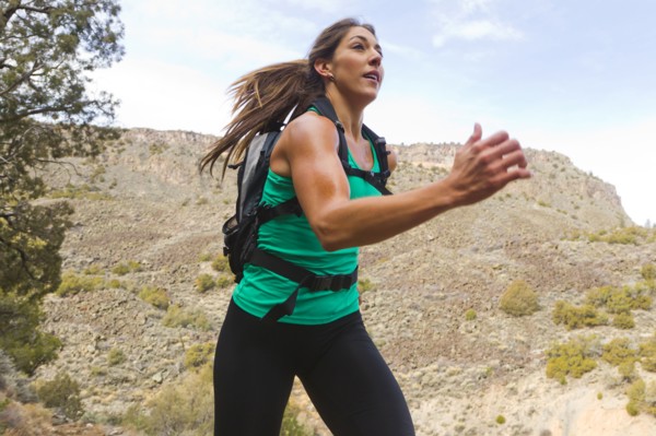 Hispanic runner training in remote area