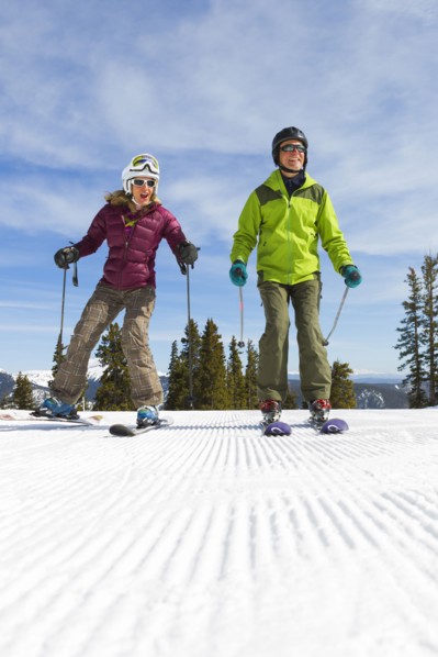 Caucasian couple skiing together