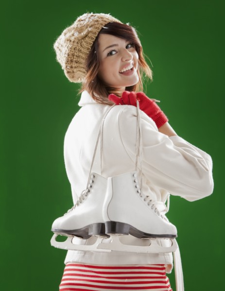 Mixed race woman carrying ice skates