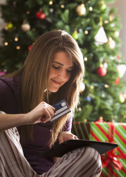 Caucasian woman Christmas shopping online with digital tablet