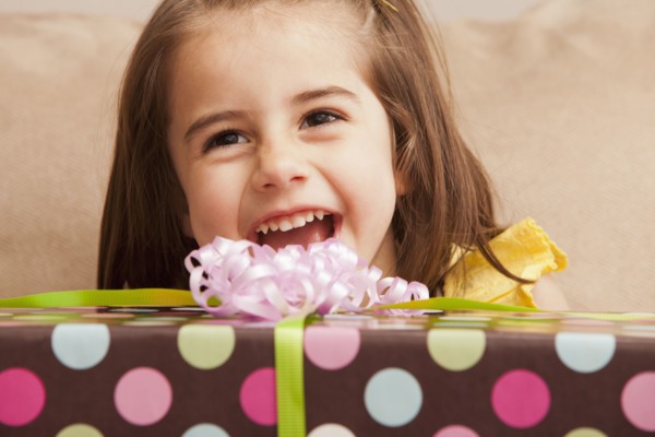 Caucasian girl holding gift