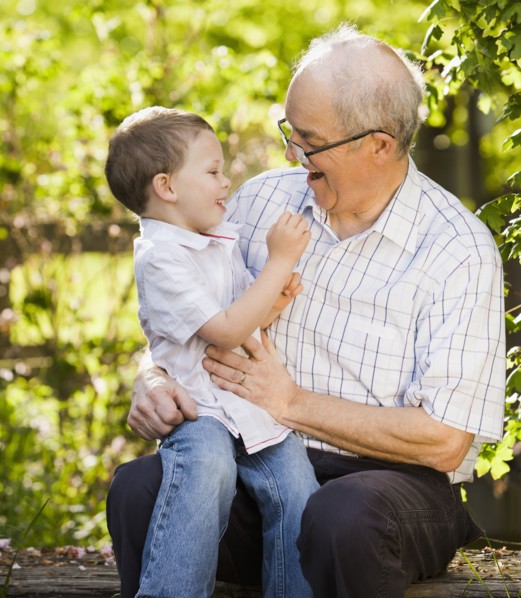 Caucasian grandfather talking with grandson