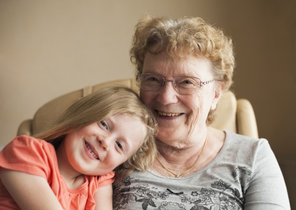 Smiling Caucasian grandmother and granddaughter